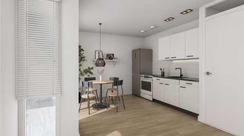 Impressie van de keuken met een kleine ronde tafel met krukjes